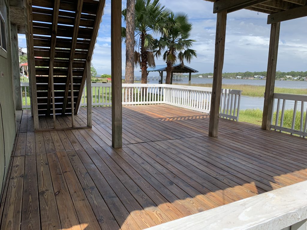 Gulf Pro Wash pressure washing a deck in Gulf Shores