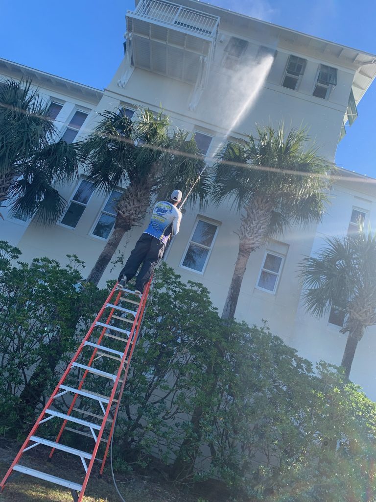 Gulf Pro Wash pressure washing a commercial building in Gulf Shores