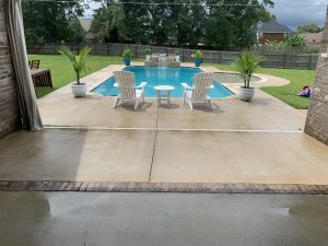 Pressure washing a pool deck