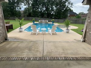 Pressure washing a dirty pool deck in Fairhope, AL