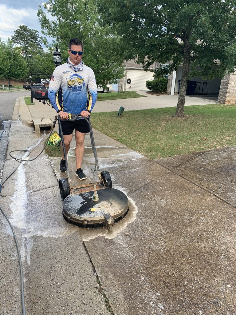 Pressure Washing a sidewalk